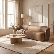 Tan leather sofa in a bright modern living room