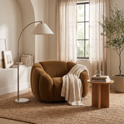 Brown Oversized Swivel Chair styled in a room