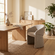 Beige Fabric Dining Armchair styled in a room