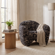 Patterned Fabric Accent Chair styled in a room