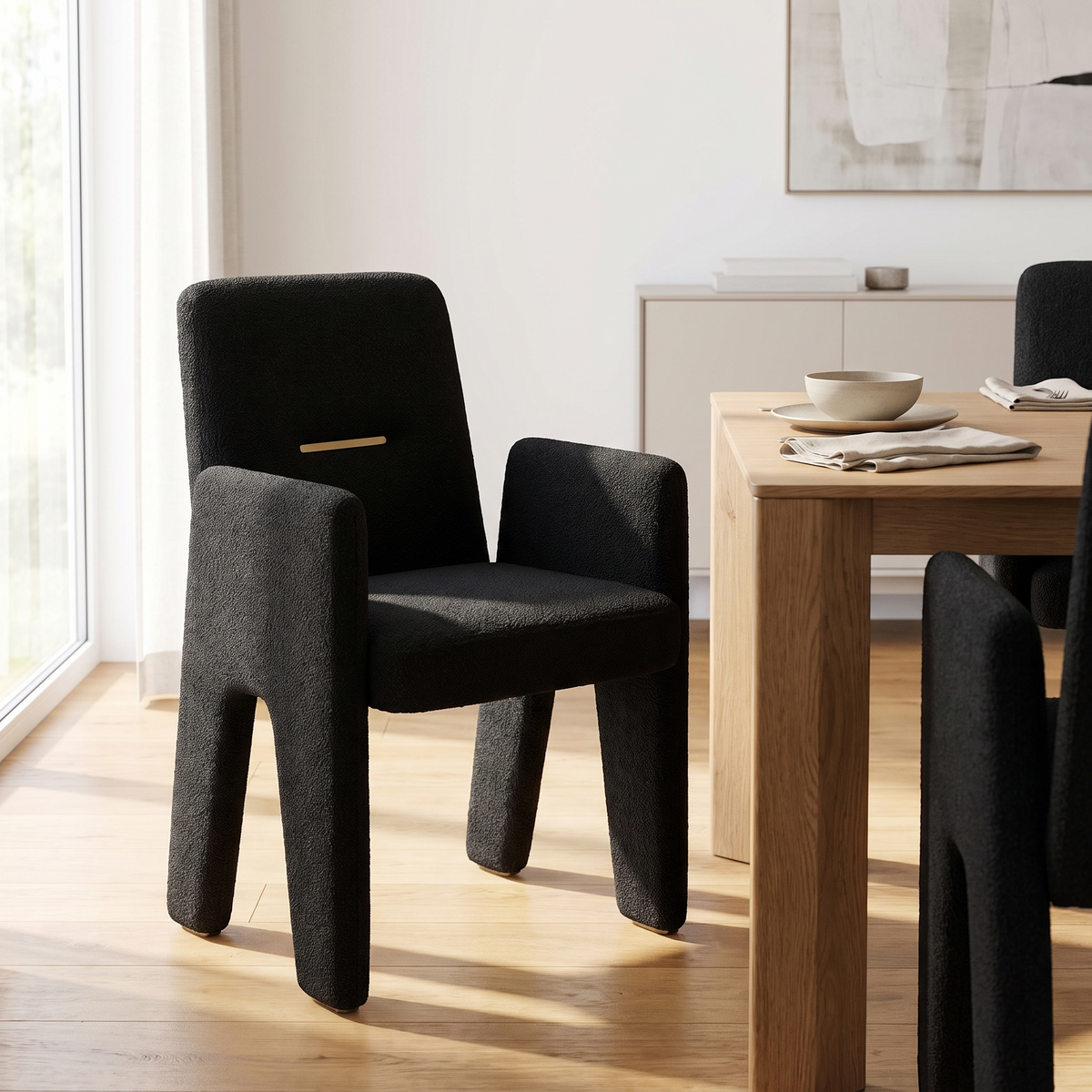Upholstered Dining Armchair in Black styled in a room